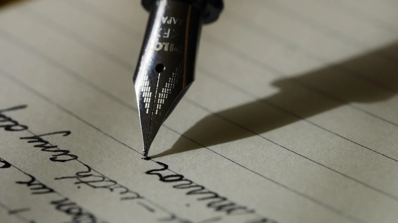 A fountain pen writing on paper